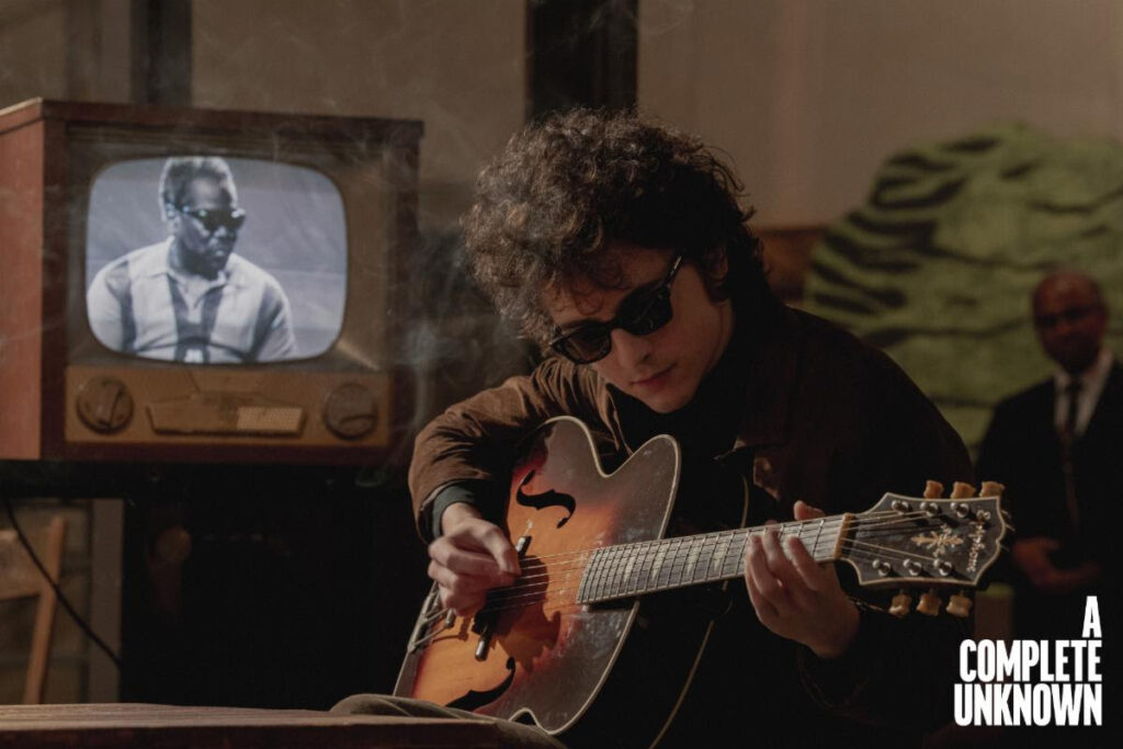 Above: Timothée Chalamet as Bob Dylan with an Epiphone Triumph; film still from A Complete Unknown (Searchlight Pictures).